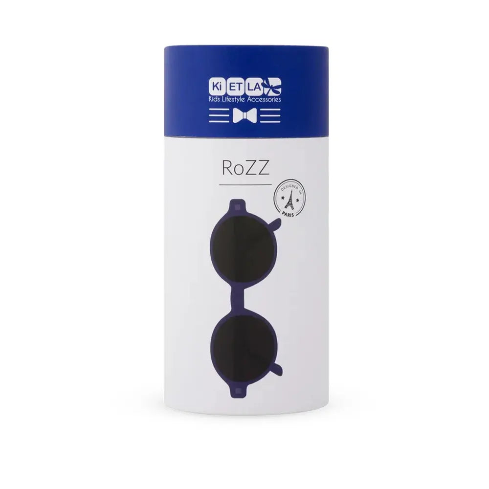 Embalagem cilíndrica dos óculos de sol Kietla ROZZ, em azul e branco, com o logótipo e um desenho dos óculos escuros.