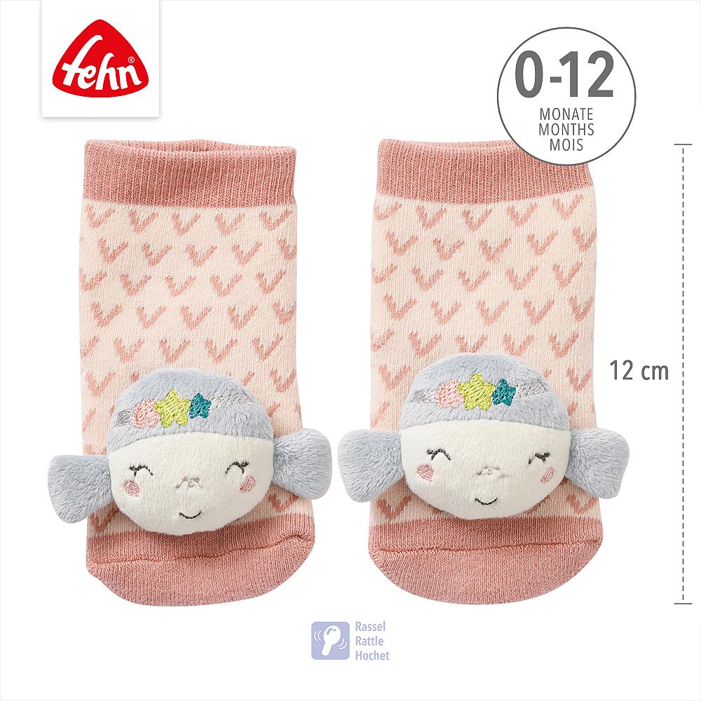 Meias Fehn Sereia com logótipo, indicação de idade (0-12 meses) e símbolo de chocalho (Rattle). Medida de 12 cm visível.