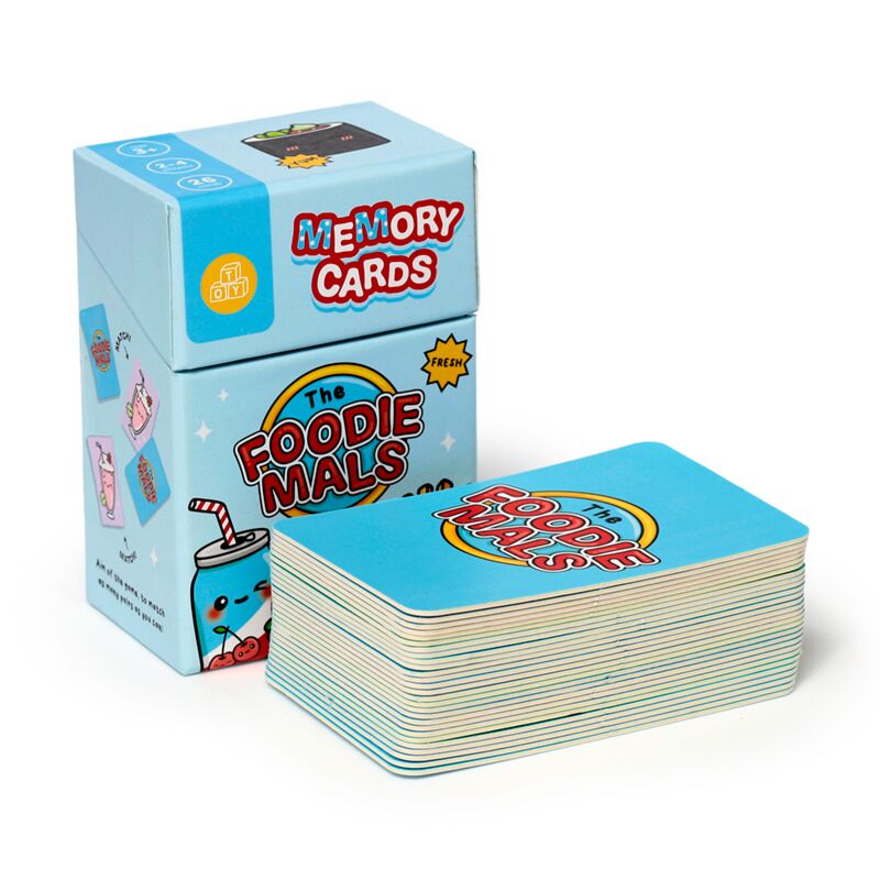 Caixa do jogo Foodiemals Memory Cards aberta, mostrando as cartas dentro.