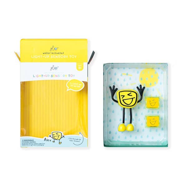Embalagem e boneco GloPals Alex amarelo, brinquedo sensorial luminoso para banho e brincadeira.