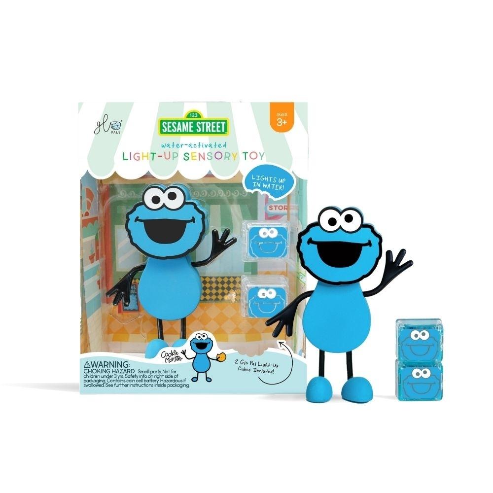 GloPals Conjunto Monstro das Bolachas Rua Sésamo: boneco do Monstro das Bolachas com dois cubos de luz azuis, embalagem ao fundo.