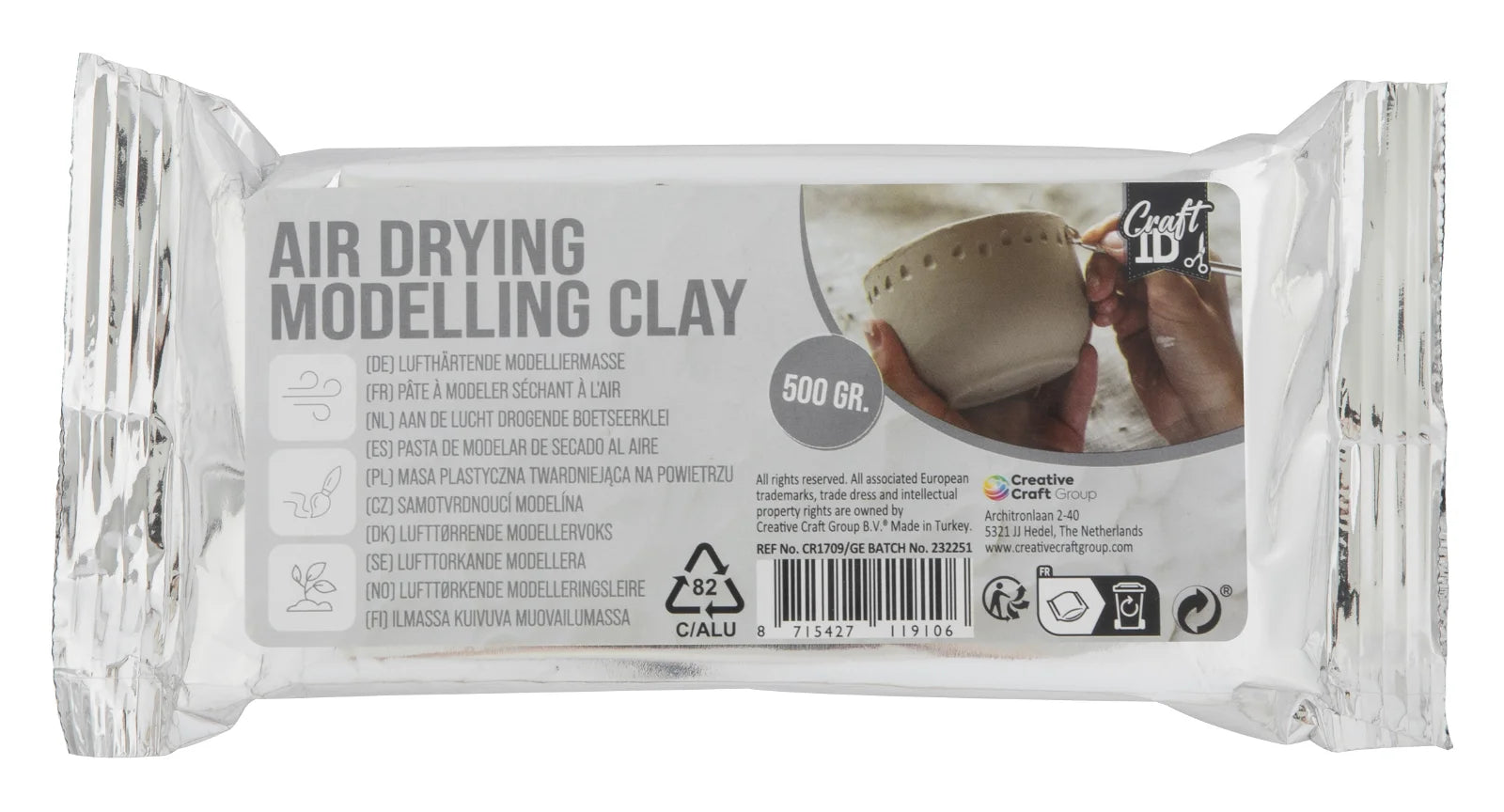 Pacote de 500g de argila de modelar Grafix cinza com secagem ao ar, mostrando exemplo de escultura.