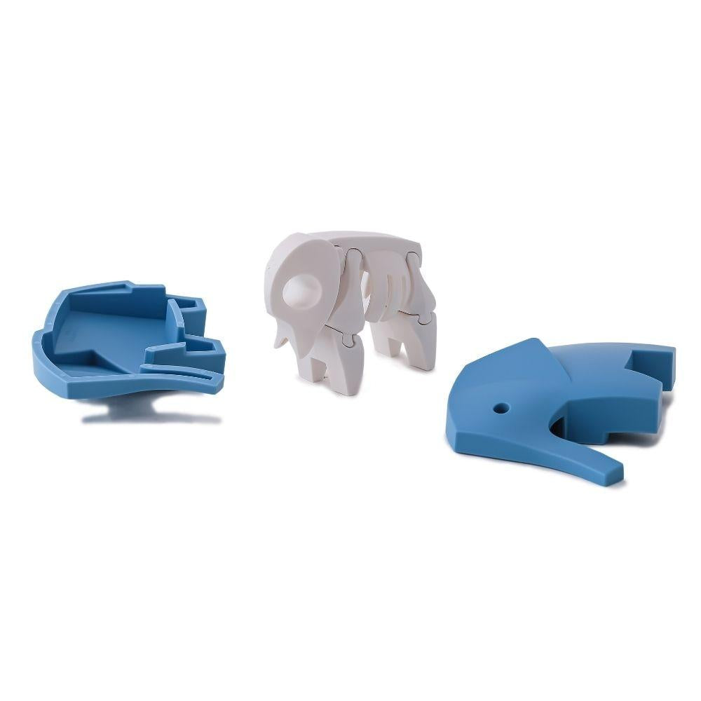 Peças desmontadas do puzzle Halftoys Elefante: base, esqueleto e corpo superior.
