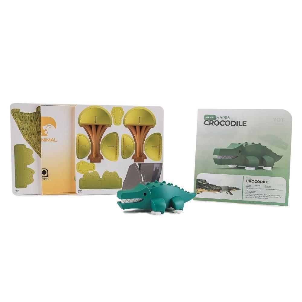 Conjunto completo Halftoys Crocodilo com as peças do diorama, o crocodilo magnético e as instruções.