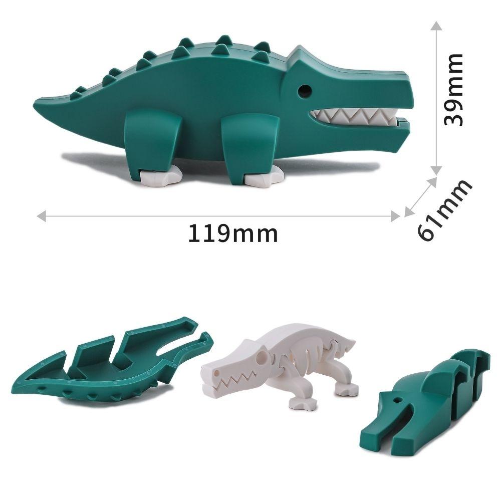 Detalhe das peças do puzzle Halftoys Crocodilo, incluindo o esqueleto e as dimensões da figura montada.