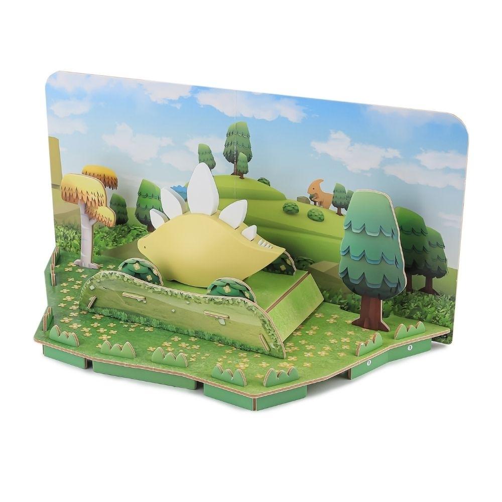 Halftoys Puzzle Diorama 3D Stegosaurus no habitat construído com árvores e colinas.