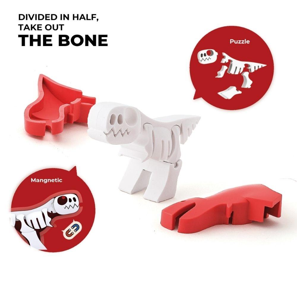 Demonstração das peças magnéticas do Halftoys T-Rex e o esqueleto puzzle branco, com texto "Divided in half, take out the bone".