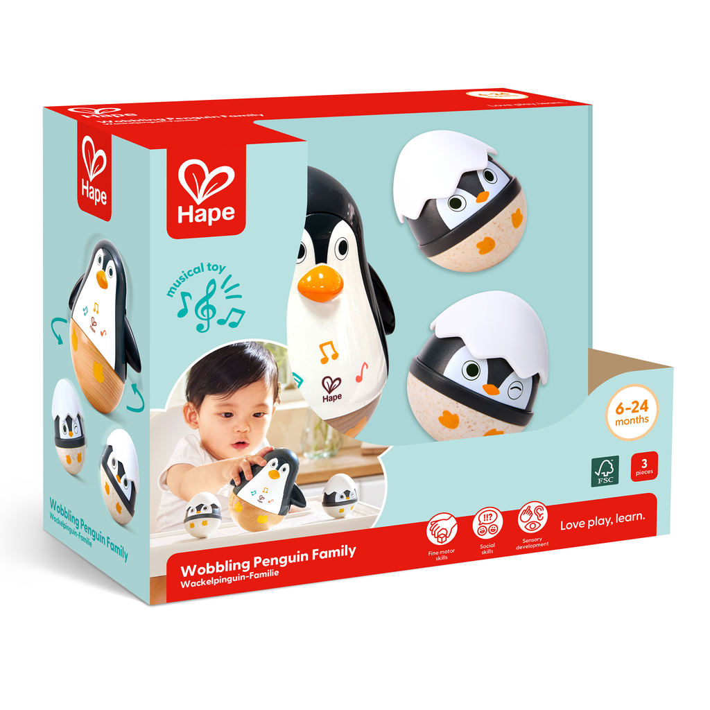 Familia Pinguim musical Hape com pinguim grande e dois ovos sonoros