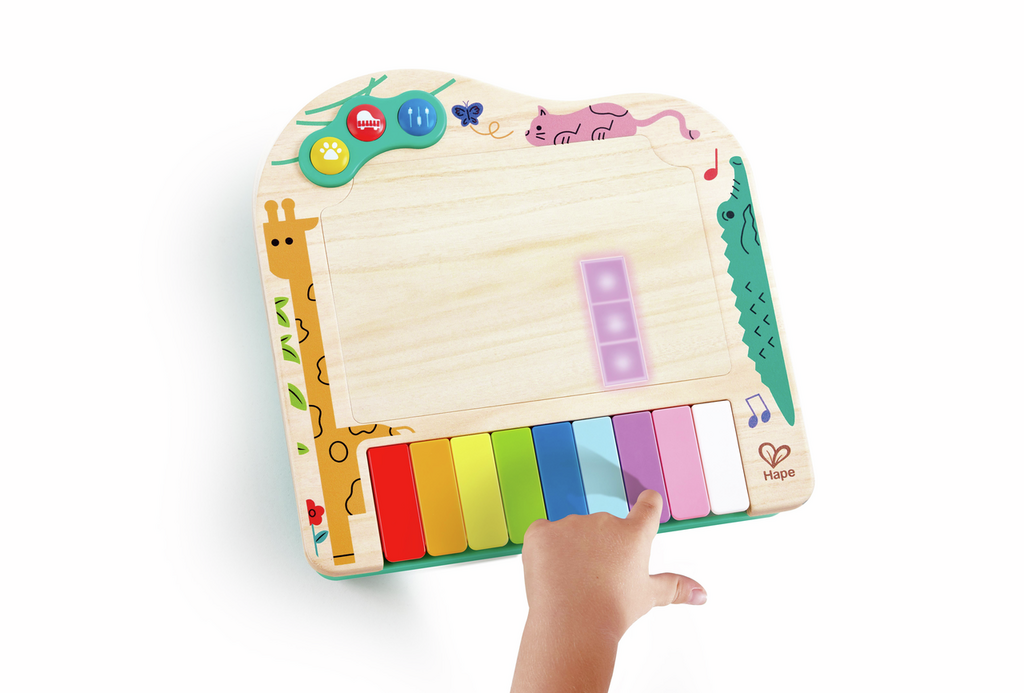 Vista superior do piano Hape Pixel Dinamico com teclas coloridas.