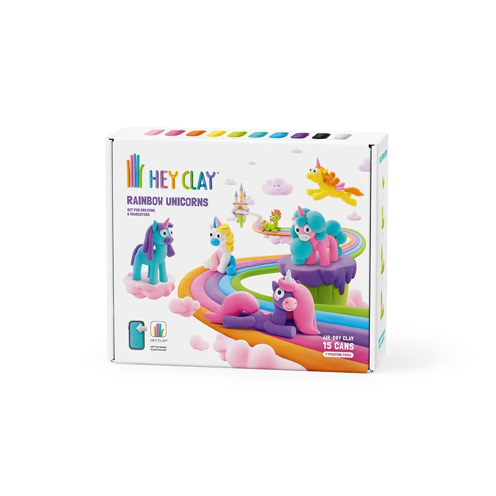Caixa do kit HEY CLAY Rainbown Unicorns com representação de unicórnios coloridos modelados em pasta de modelar sobre um caminho de arco-íris.