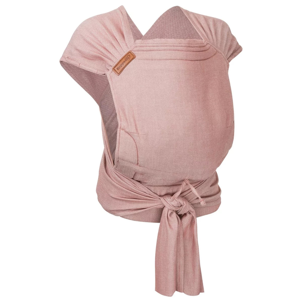 Porta-bebés Hoppediz Hop-Tye Advanced half-buckle em tecido rosa claro com padrão espinha de peixe, visto pela frente, com alças cruzadas e atadas à cintura.