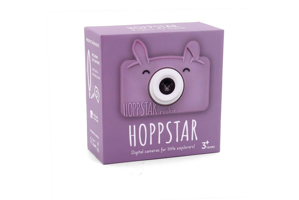 Embalagem da câmara digital Hoppstar Rookie Blossom, cor lilás, destacando o design de coelho e a indicação de idade 3+.