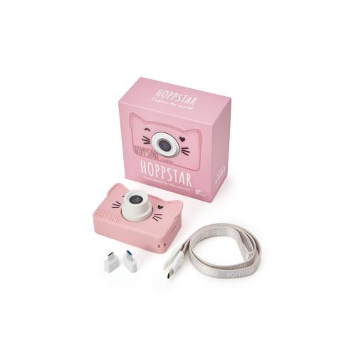 Conteúdo completo da embalagem da Hoppstar Rookie: câmara rosa, caixa, cordão 2 em 1 e adaptadores, sobre fundo branco.