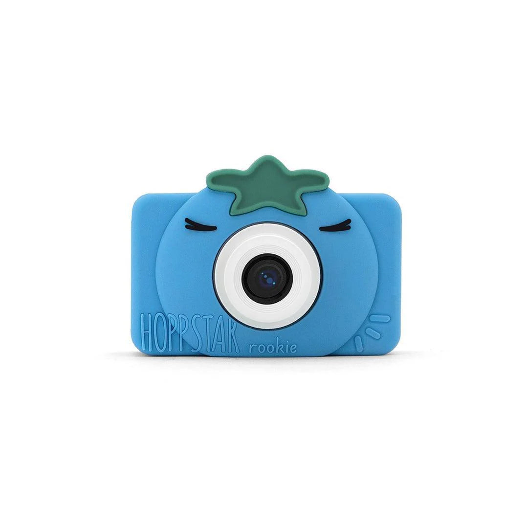 Máquina fotográfica digital Hoppstar Rookie Bluebelle em silicone azul, vista frontal, com detalhes de estrela verde no topo e o nome Hoppstar Rookie.
