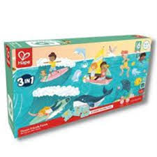 Embalagem do Hape Puzzle 3 em 1 Oceano, com o logótipo Hape e ilustrações vibrantes de cenas de praia e mar.