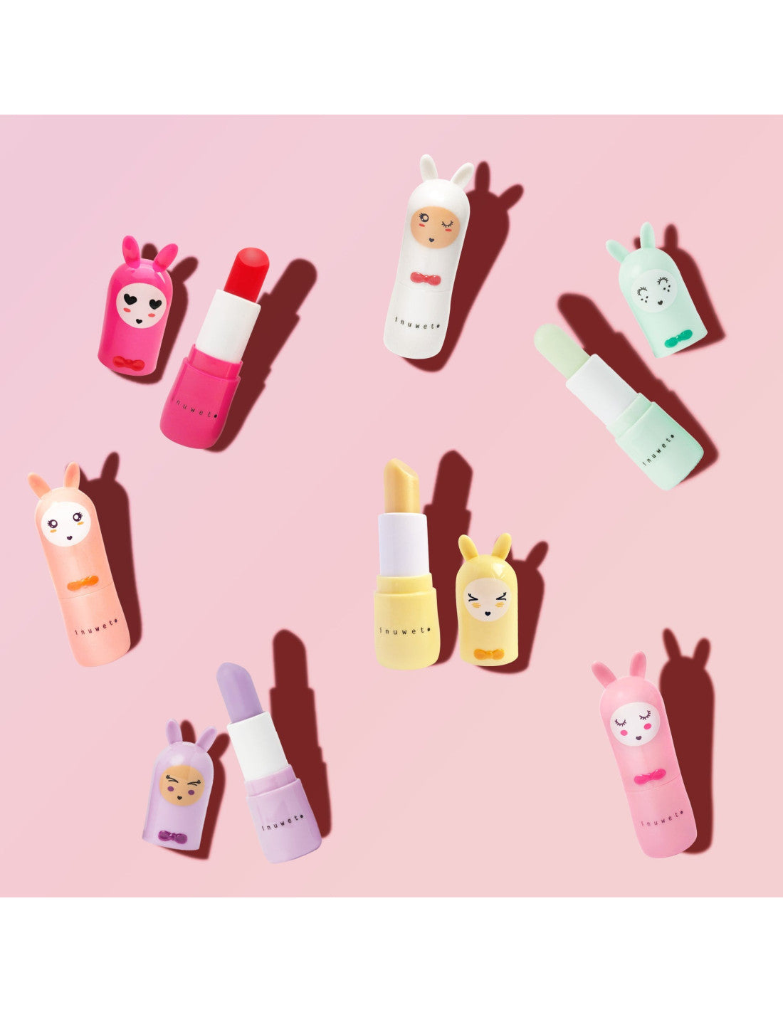 Variedade de bálsamos labiais Inuwet Bunny em diferentes cores e aromas, alguns abertos revelando o stick.