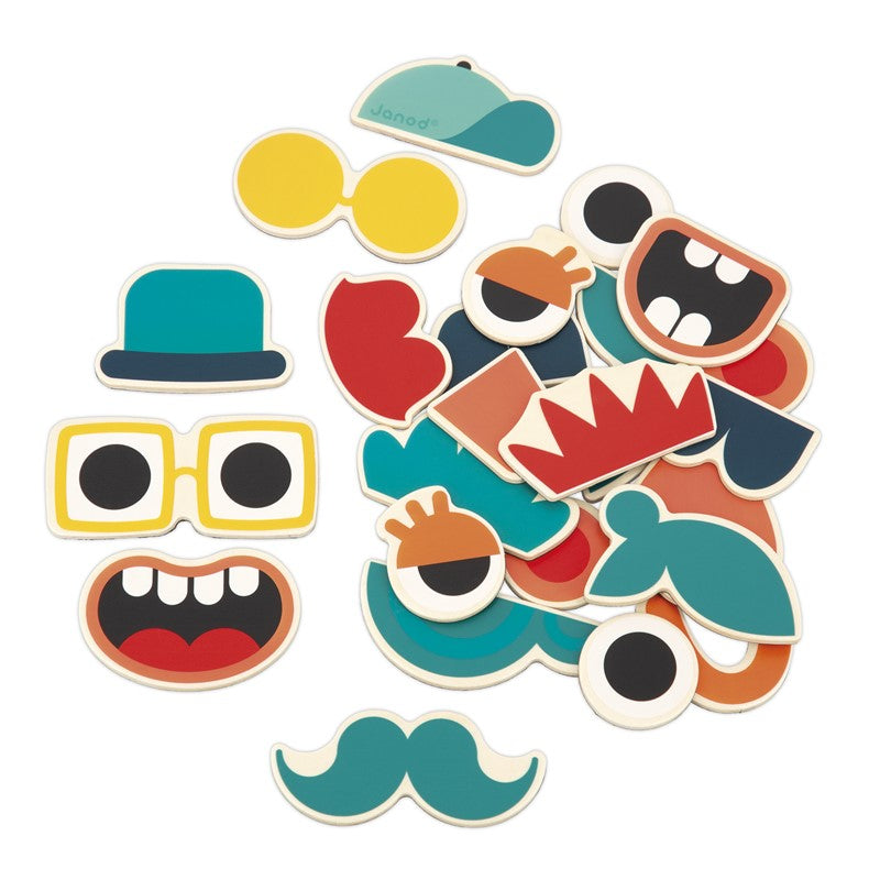Detalhe dos ímanes de madeira Janod, mostrando olhos, narizes e bocas variados para personalização.