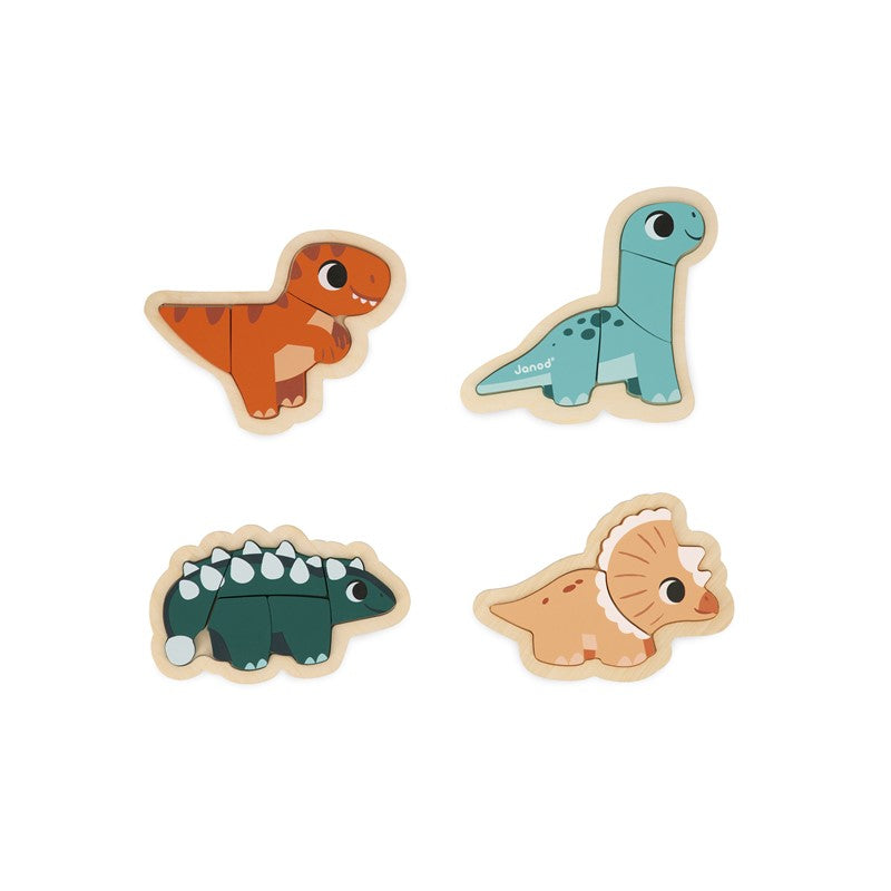 Os quatro dinossauros de madeira (Triceratops, T-Rex, Diplodocus e Ankylosaurus) montados, vistos de cima.