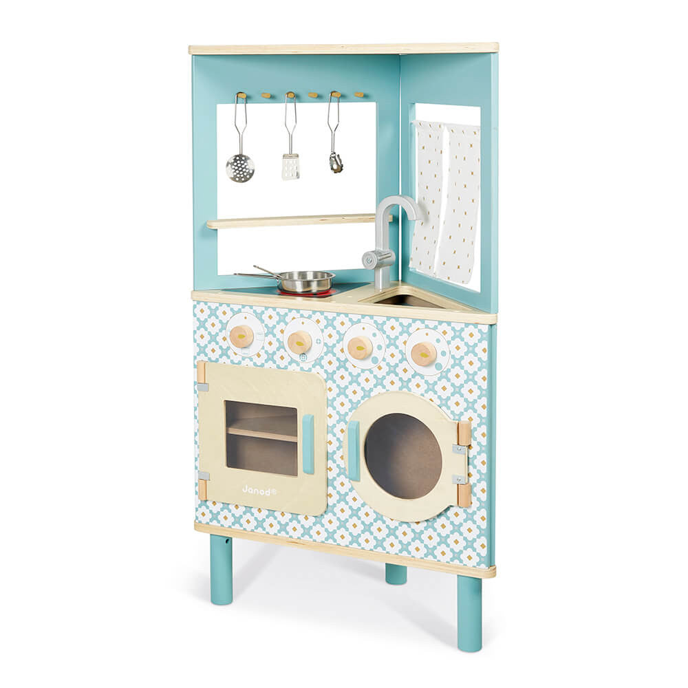 Cozinha infantil triangular Janod em azul com padrão floral, apresentando forno, máquina de lavar e lava-loiça.