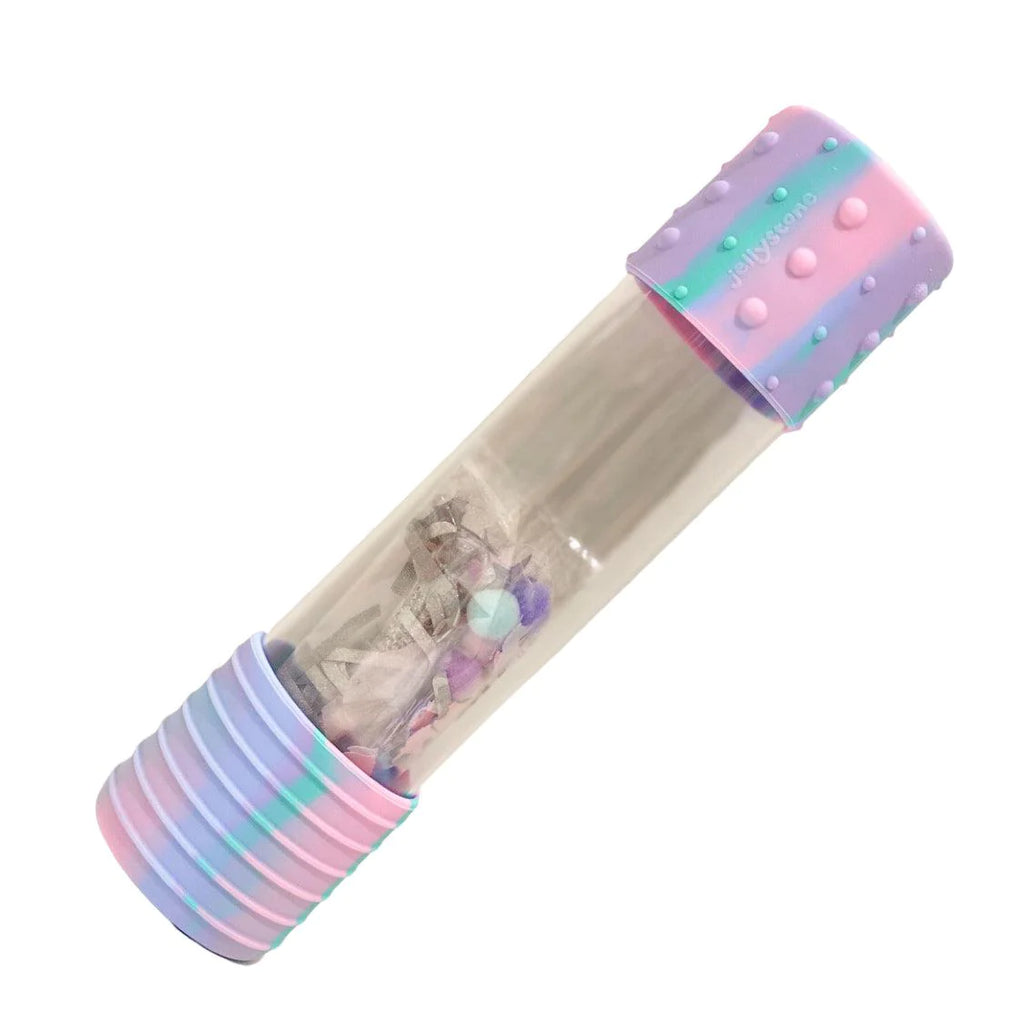 Garrafa sensorial Jellystone DIY vazia, transparente, com tampas de silicone em tons pastel (roxo, azul, rosa) e elementos soltos no interior.