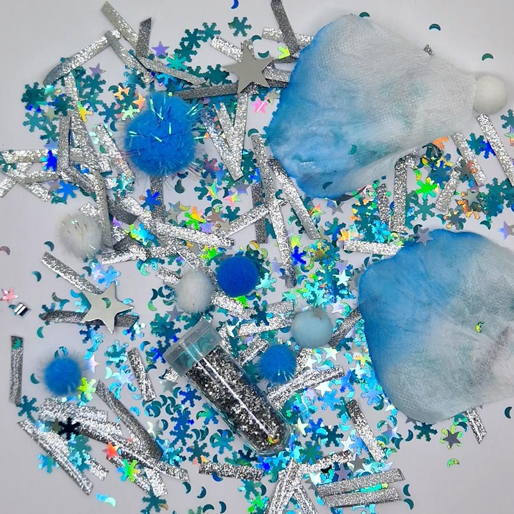 Kit de enchimento DIY para Garrafa da Calma com lantejoulas de flocos de neve, estrelas, pompons azuis e elementos de tecido, incluindo um pequeno tubo de enchimento.