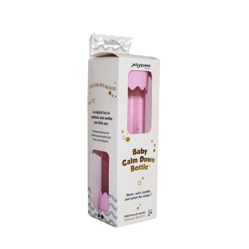 Embalagem da Jellystone Garrafa da Calma para bebé, cor-de-rosa, com texto promocional e indicação de idade 0+.