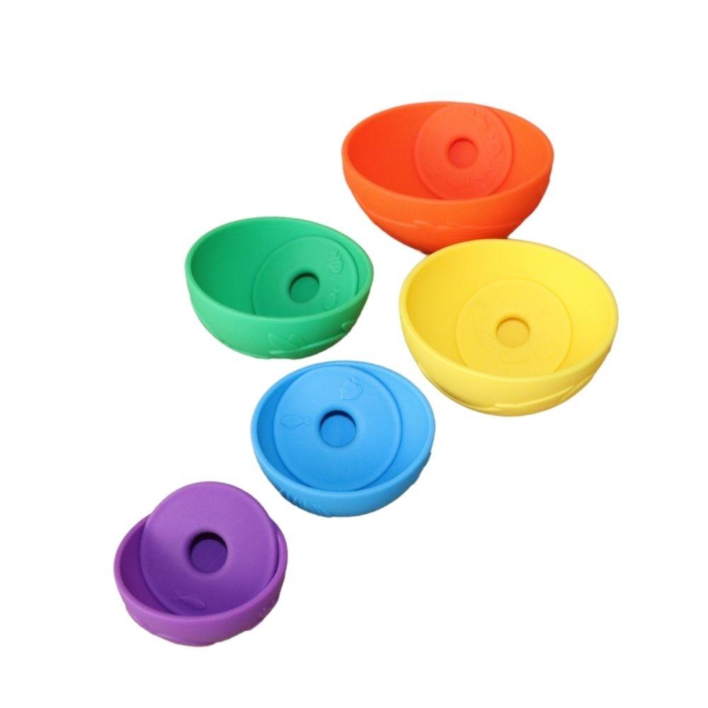 Conjunto de 5 copos e 5 anéis Jellystone Pirâmide coloridos vistos de cima, mostrando os anéis dentro dos copos.