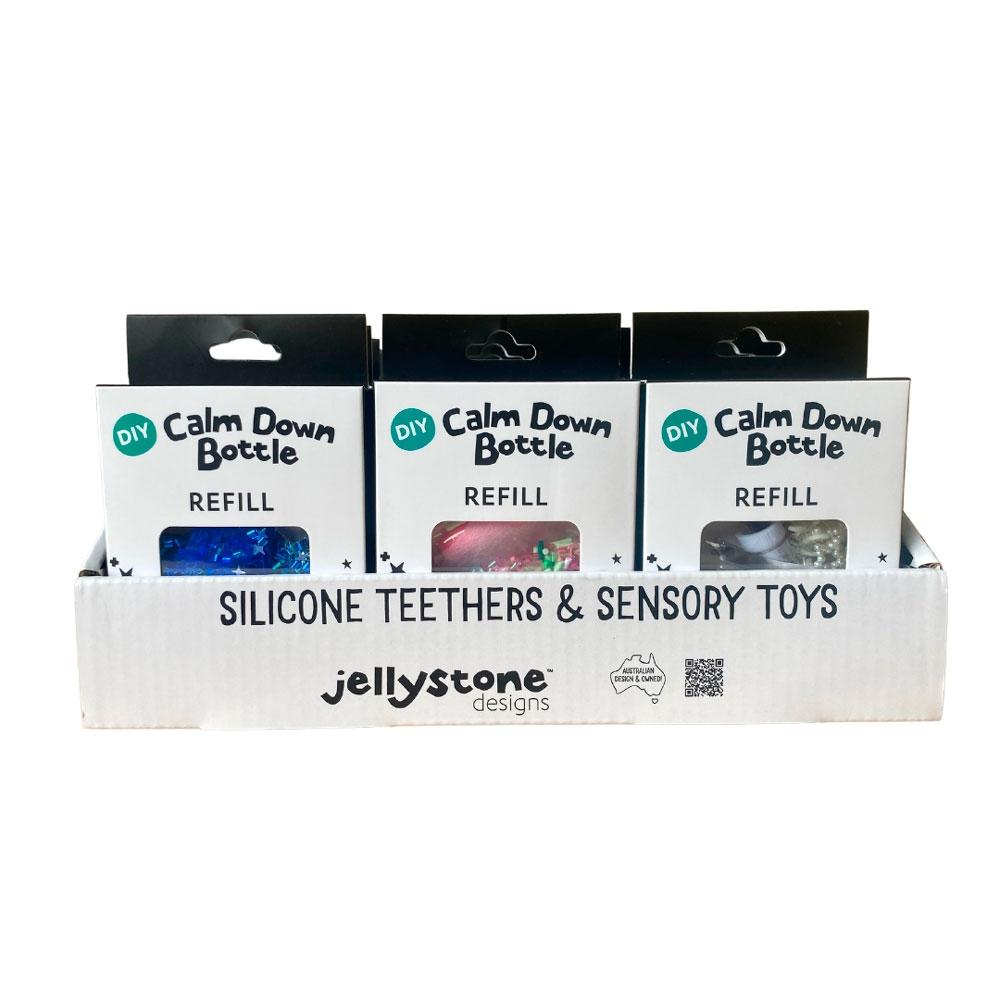 Exposição de três embalagens de recarga Jellystone para garrafas da calma numa caixa de apresentação.