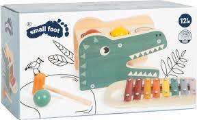 Caixa do jogo de martelar com xilofone small foot, mostrando o dinossauro, as bolas e o xilofone. Brinquedo educativo para bebês a partir de 12 meses.