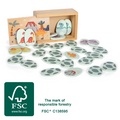 Todas as peças do jogo de memória Small Foot espalhadas, mostrando os ovos de dinossauro com ilustrações coloridas.