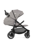 Imagem principal do carrinho de passeio Joie Litetrax PRO cinzento, dobrado de forma compacta, mostrando o fecho automático e facilidade de arrumação.
