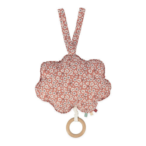 Verso da nuvem musical Kaloo, tecido com padrão floral em tons de rosa/terracota, com alças e anel de madeira visíveis.