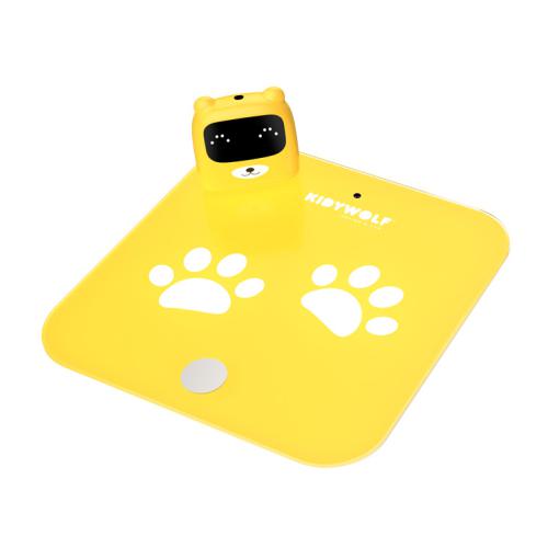 Balança digital infantil KidyWolf amarela com base em forma de patas e ecrã de urso destacável, vista superior.