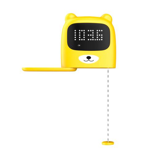Ecrã de urso da balança KidyWolf amarelo, mostrando a altura (103.6) com fita métrica extensível.