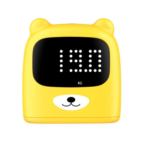 Ecrã de urso da balança KidyWolf amarelo, exibindo o peso (19.0 KG) em formato digital de matriz de pontos.