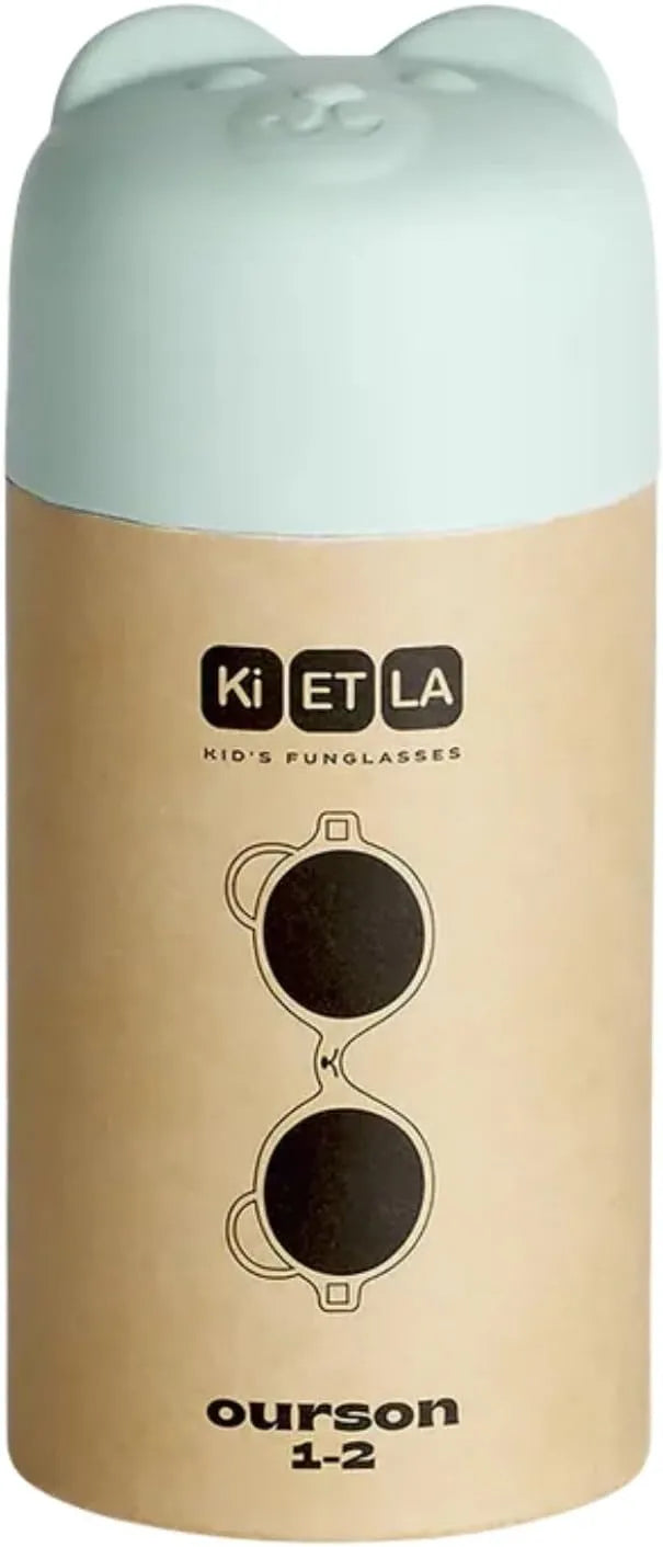 Embalagem de cartão dos óculos de sol Kietla Urso Almond Green, mostrando o logótipo da marca e o nome do modelo.