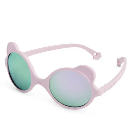 Óculos de sol Kietla Urso Pink para bebé com armação flexível e lentes espelhadas verde-azuladas.