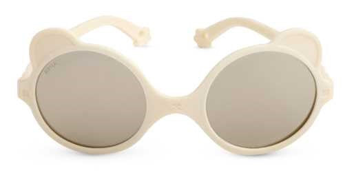 Óculos de sol Kietla Urso Cream, vista frontal, armação ergonómica bege clara com lentes espelhadas e detalhes de orelhas.
