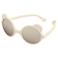 Óculos de sol Kietla Urso Cream para bebé, armação bege clara com orelhas de urso e lentes espelhadas, vista lateral.