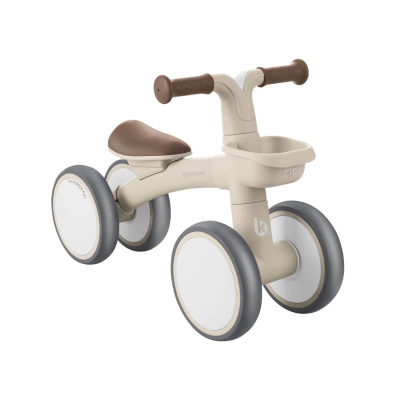 Bicicleta de equilíbrio Kikkaboo ZIPI de quatro rodas, cor bege e cinzento, com guiador castanho e cesto frontal, isolada em fundo branco.