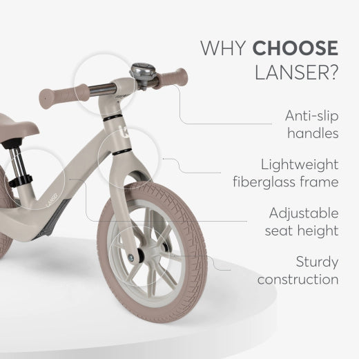 Diagrama com setas a indicar as características principais da bicicleta Lancer: punhos antiderrapantes, estrutura leve de fibra de vidro, assento ajustável e construção robusta.