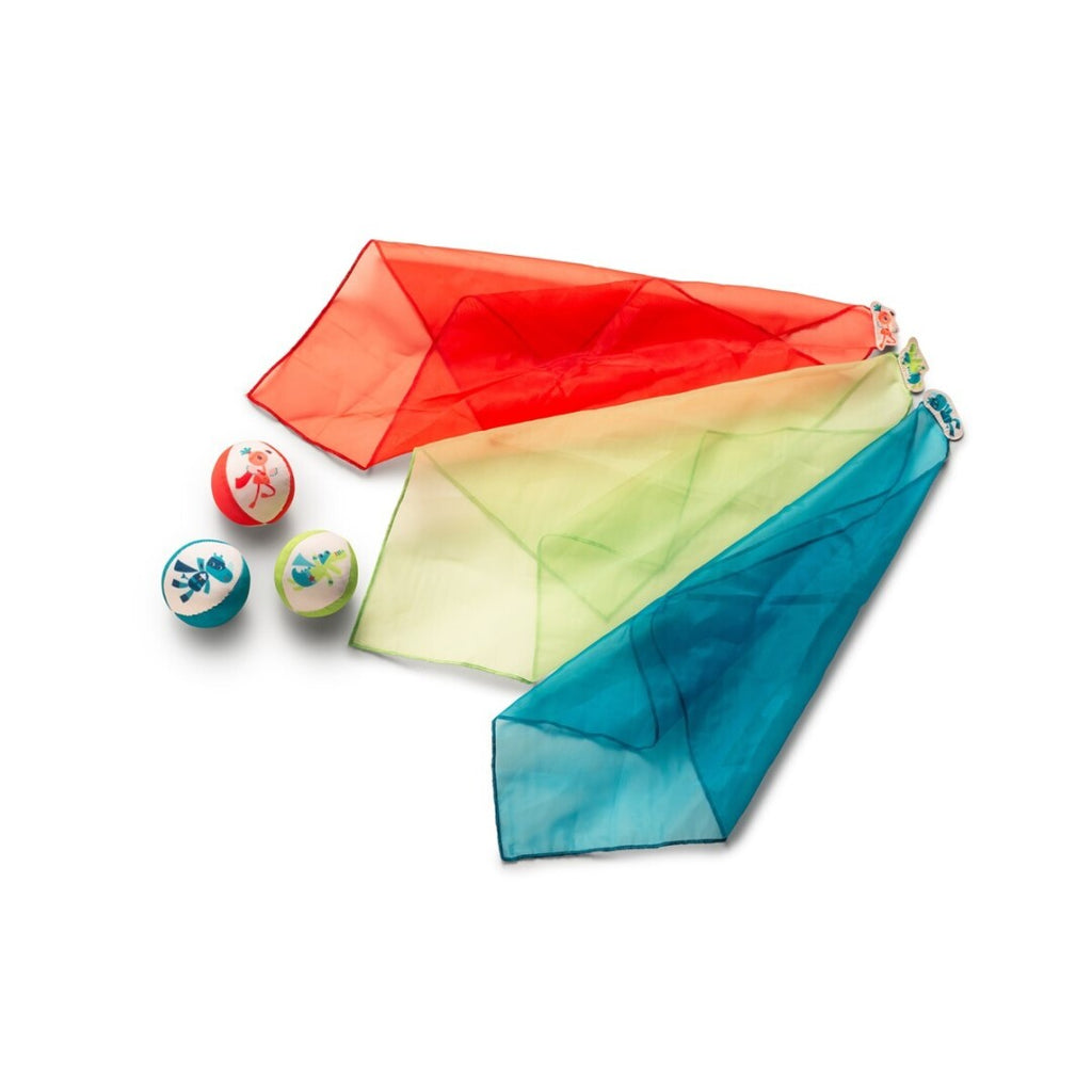 Conjunto de malabarismo Lilliputiens com três bolas e três lenços coloridos, ilustrados com personagens da marca.
