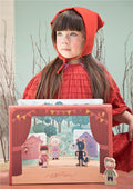 Teatro magnético Lilliputiens Capuchinho Vermelho aberto, exibindo o cenário da floresta e as 4 personagens de madeira.