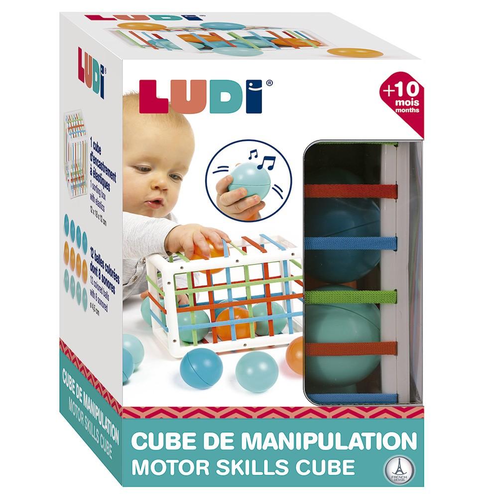 O conjunto completo Ludi: cubo de manipulação e as 12 bolas coloridas dispostas ao lado, evidenciando o produto completo.