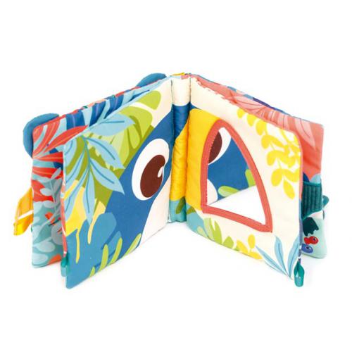 Livro sensorial de pano Ludi Selva aberto, mostrando páginas coloridas com estampas tropicais e um espelho de segurança triangular.