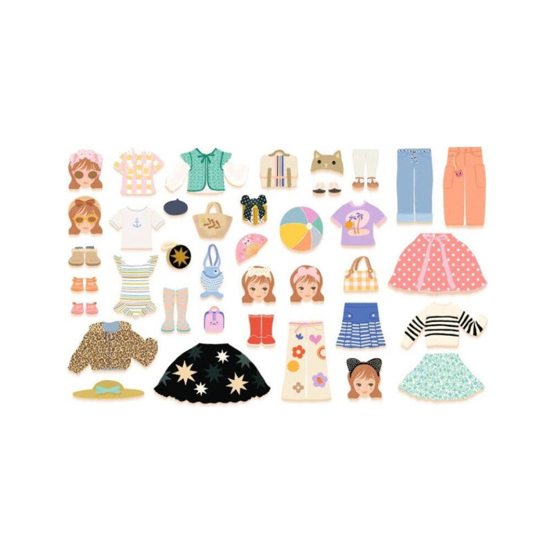 Todas as peças de roupa, acessórios, cabeças e peças inferiores do jogo magnético Djeco dispostas sobre fundo branco.