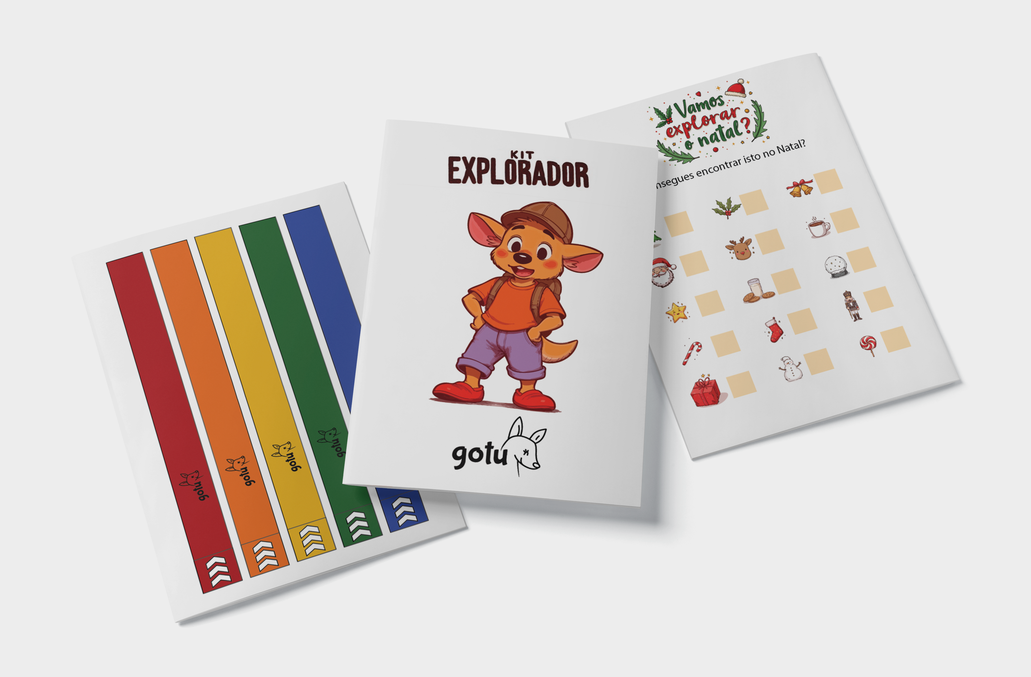 Conjunto de materiais do Kit Explorador com pulseiras, capa do ebook e ficha de jogo "i-spy" com objetos de Natal.