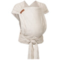 Mei Tai Hoppediz Hop Tye Advanced Grenada (linho natural) vestido num adulto, mostrando o bebé virado para a frente (posição frontal).