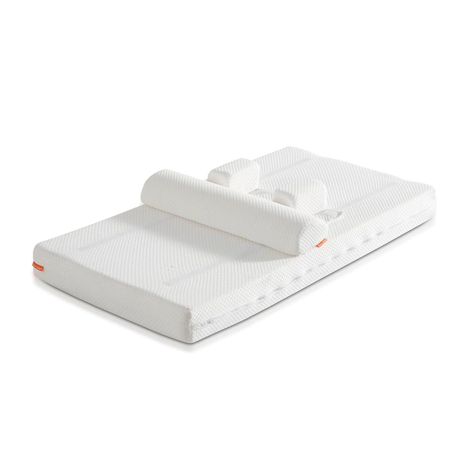 Colchão Micuna de núcleo articulado para berço, com sistema anti-rotação e semi-rolo, em fundo branco.