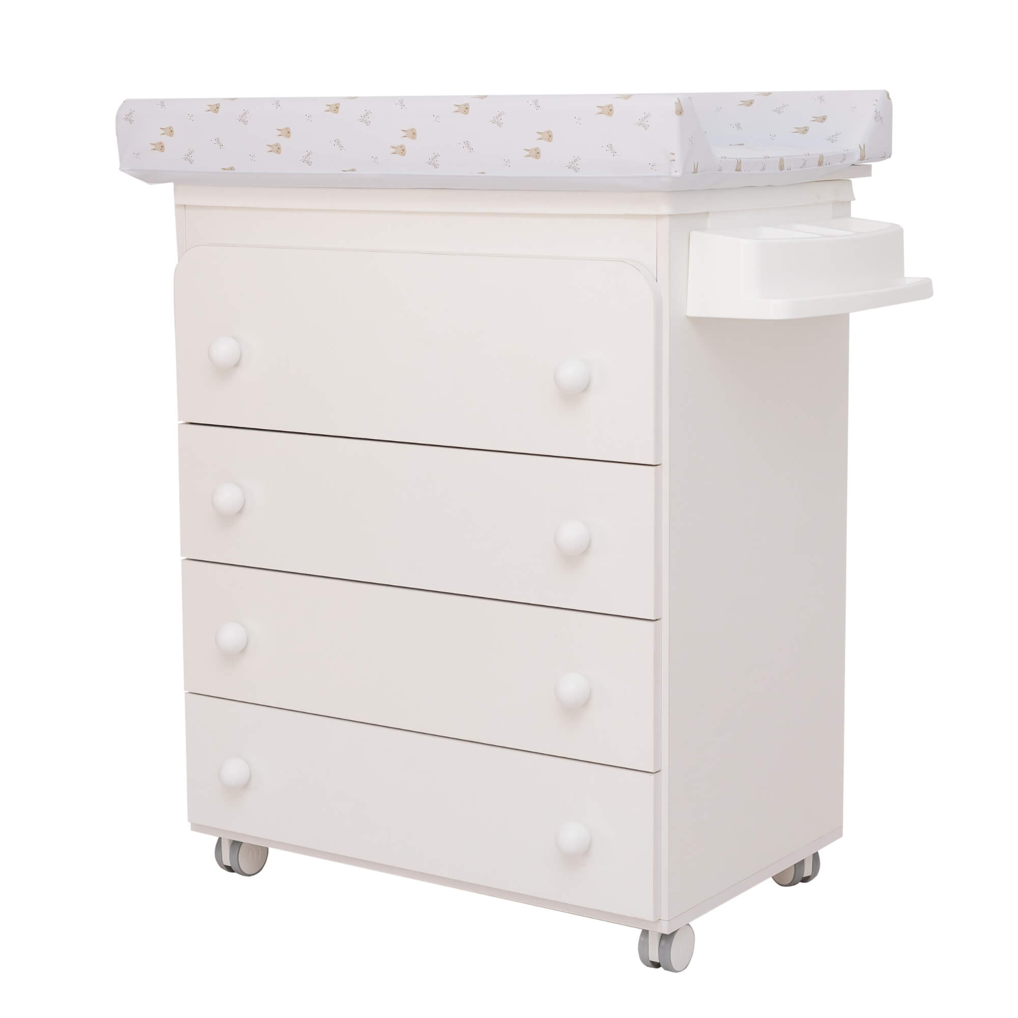Vista lateral do móvel muda-fraldas Micuna branco com 4 gavetas e tabuleiro com padrão de coelhos/coroas.